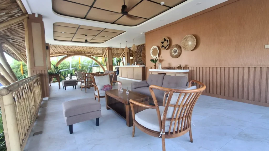 Reclaimed teak and rattan furniture in a sustainable Bali interior lounge