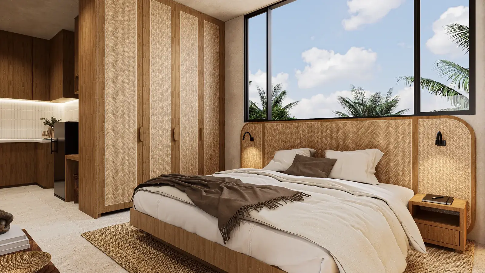 Wide view of the Mauritius guesthouse studio unit showing the platform bed and the bamboo kitchen and wardrobe wall