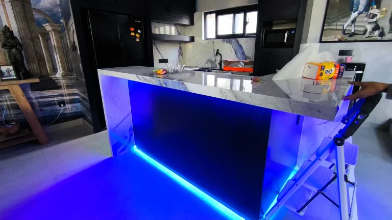 The blue-marble splashback and navy cabinetry installed on site during the villa fit-out