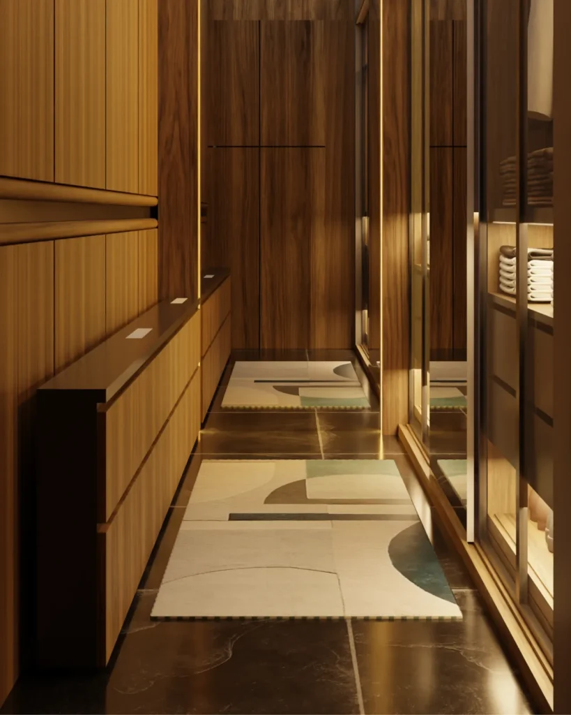 Render of the walk-in wardrobe corridor with mirror fronted sliding doors, lit clothes rails and overhead luggage storage